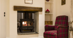 stove fire with red chair